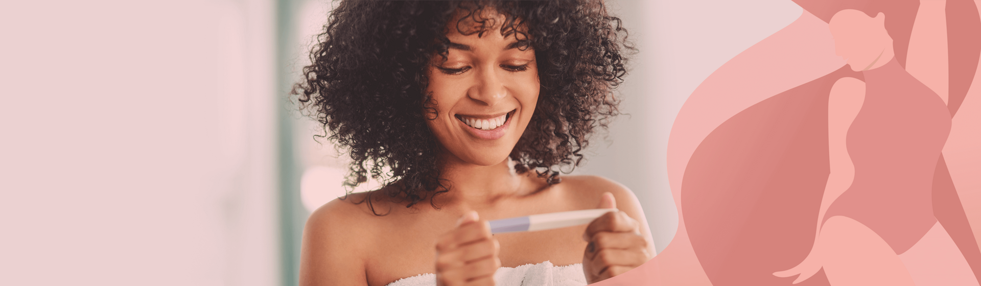 Smiling woman wrapped in a towel looking at a pregnancy test. Smiling woman wrapped in a towel looking at a pregnancy test.